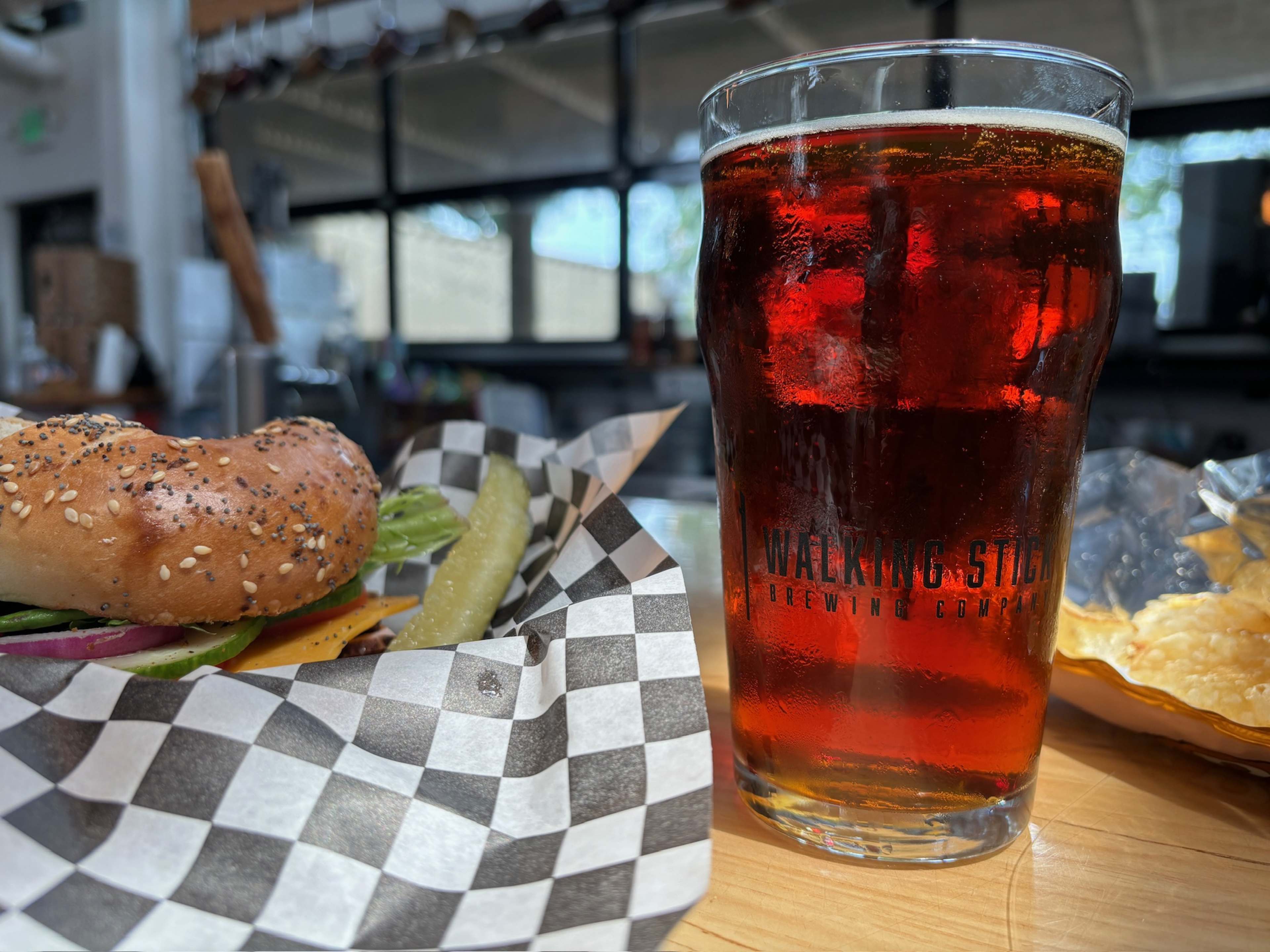 pint of amber beer in a glass that reads "Walking Stick Brewery"