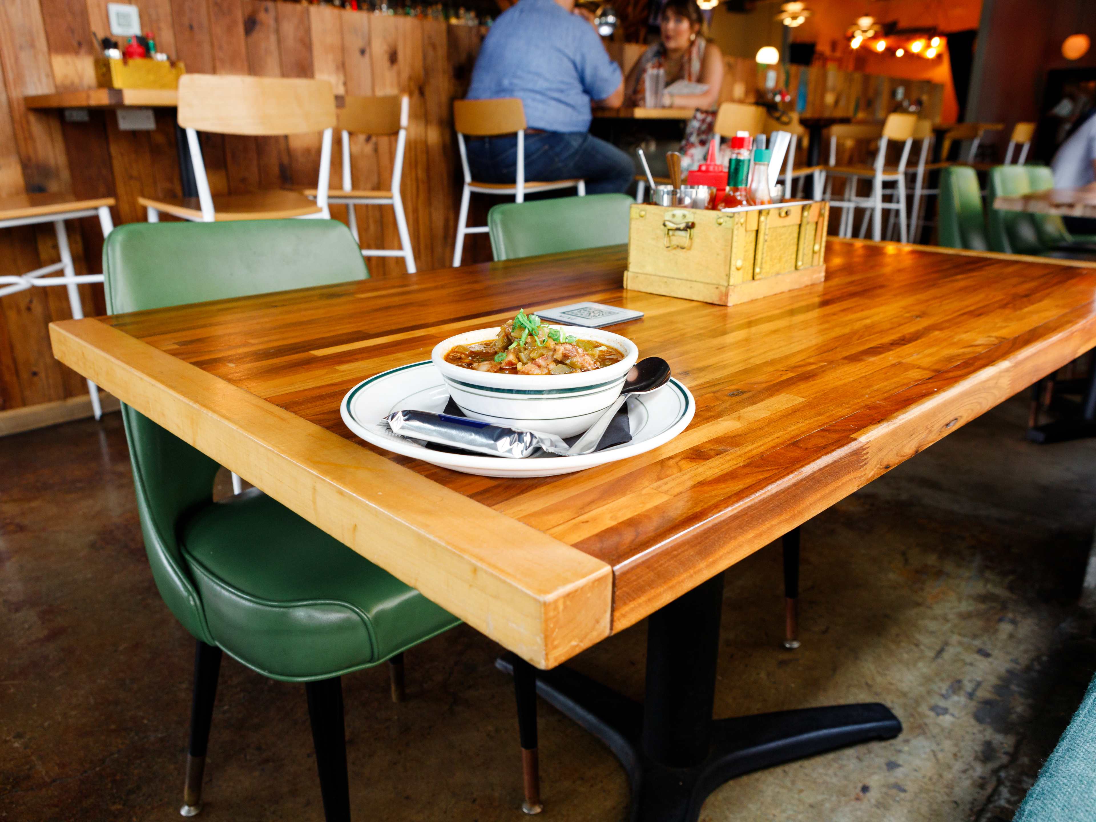 A bowl of gumbo on a wooden table at Winnie's.