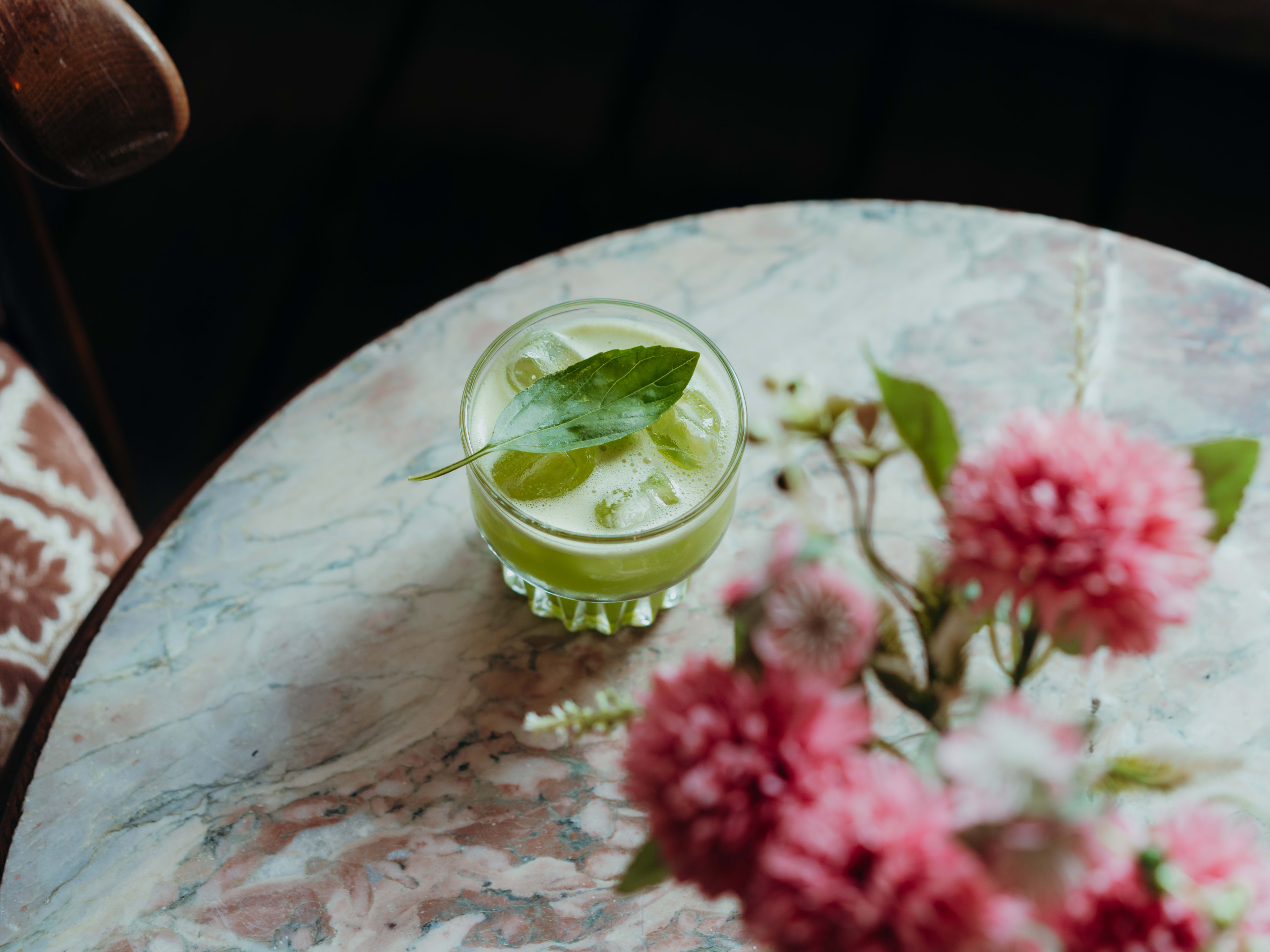 Gin basil smash on marble table at Wohnzimmer Bar