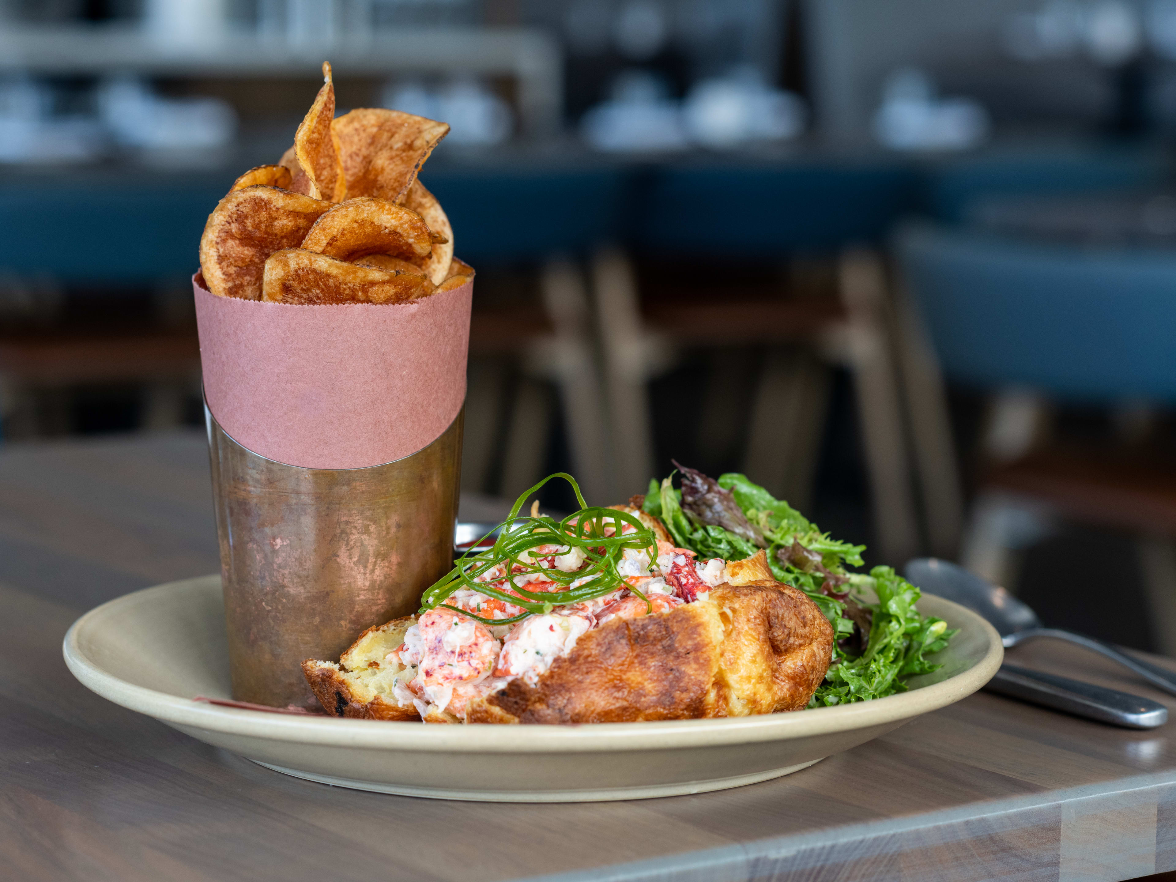 Lobster popover with side of housemaid potato chips at Woods Hill Pier 4