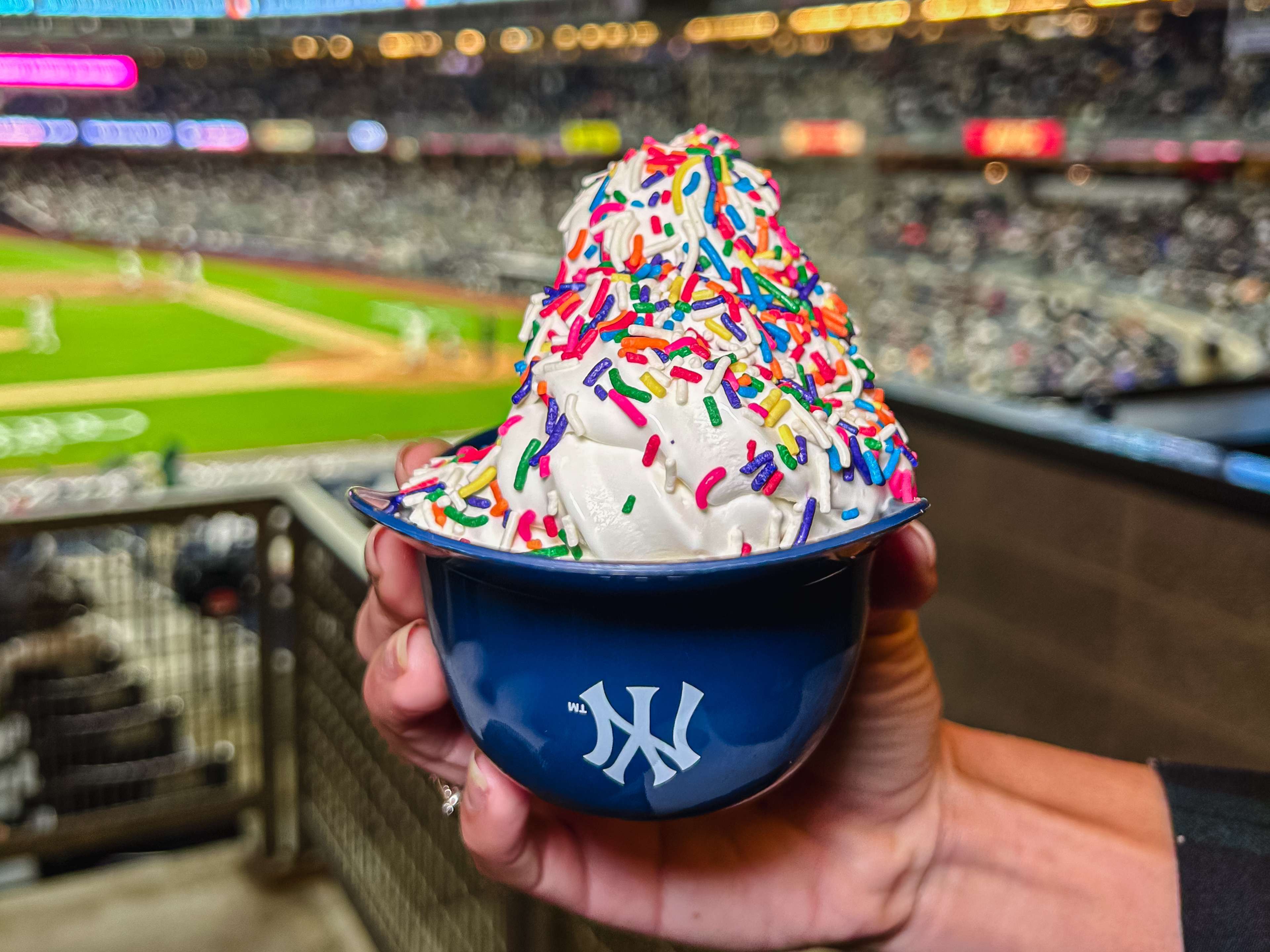 a yankee stadium helmet cup full of vanilla soft serve