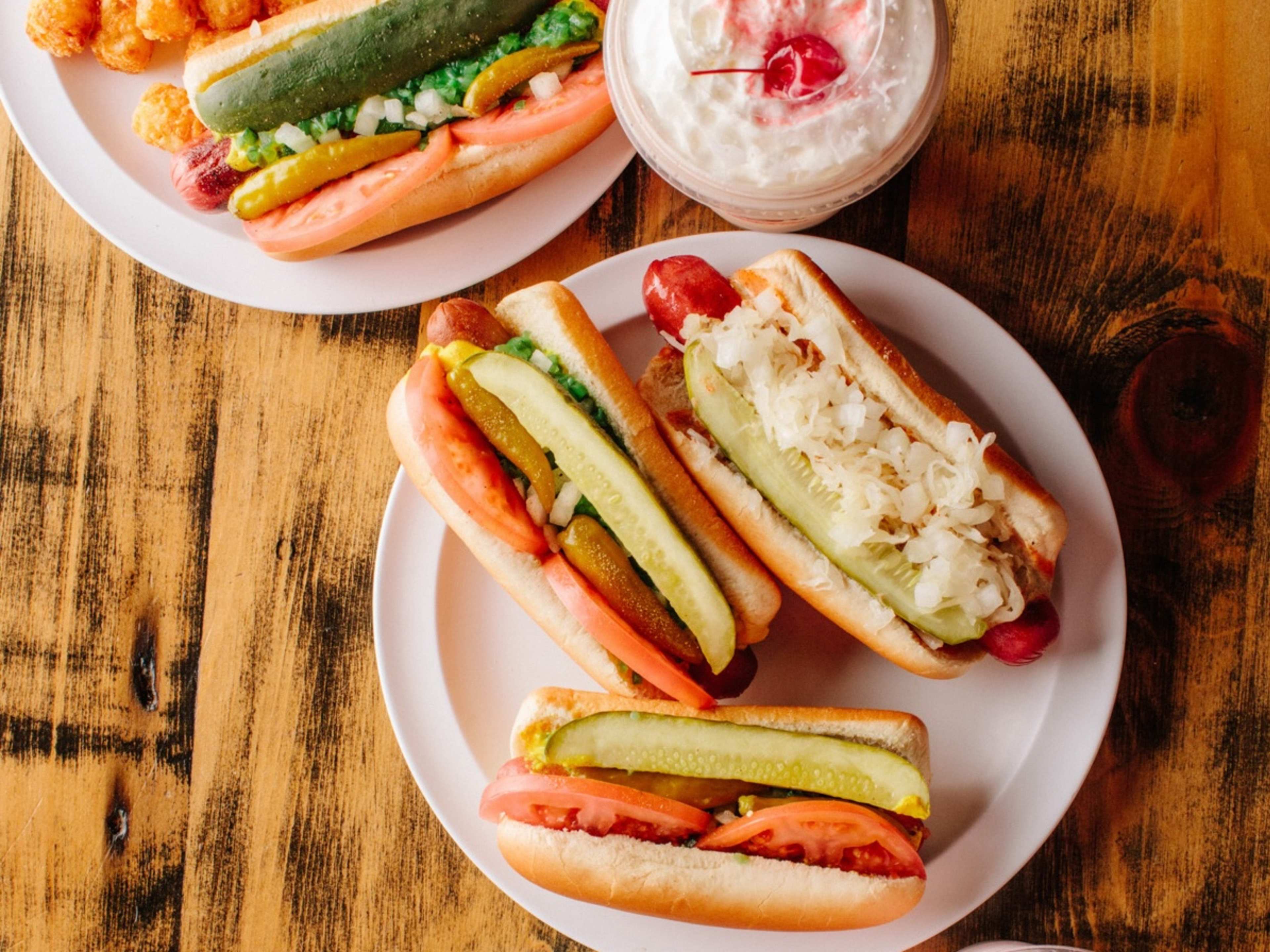 A spread of hot dogs and milk shakes from Devil Dawgs.