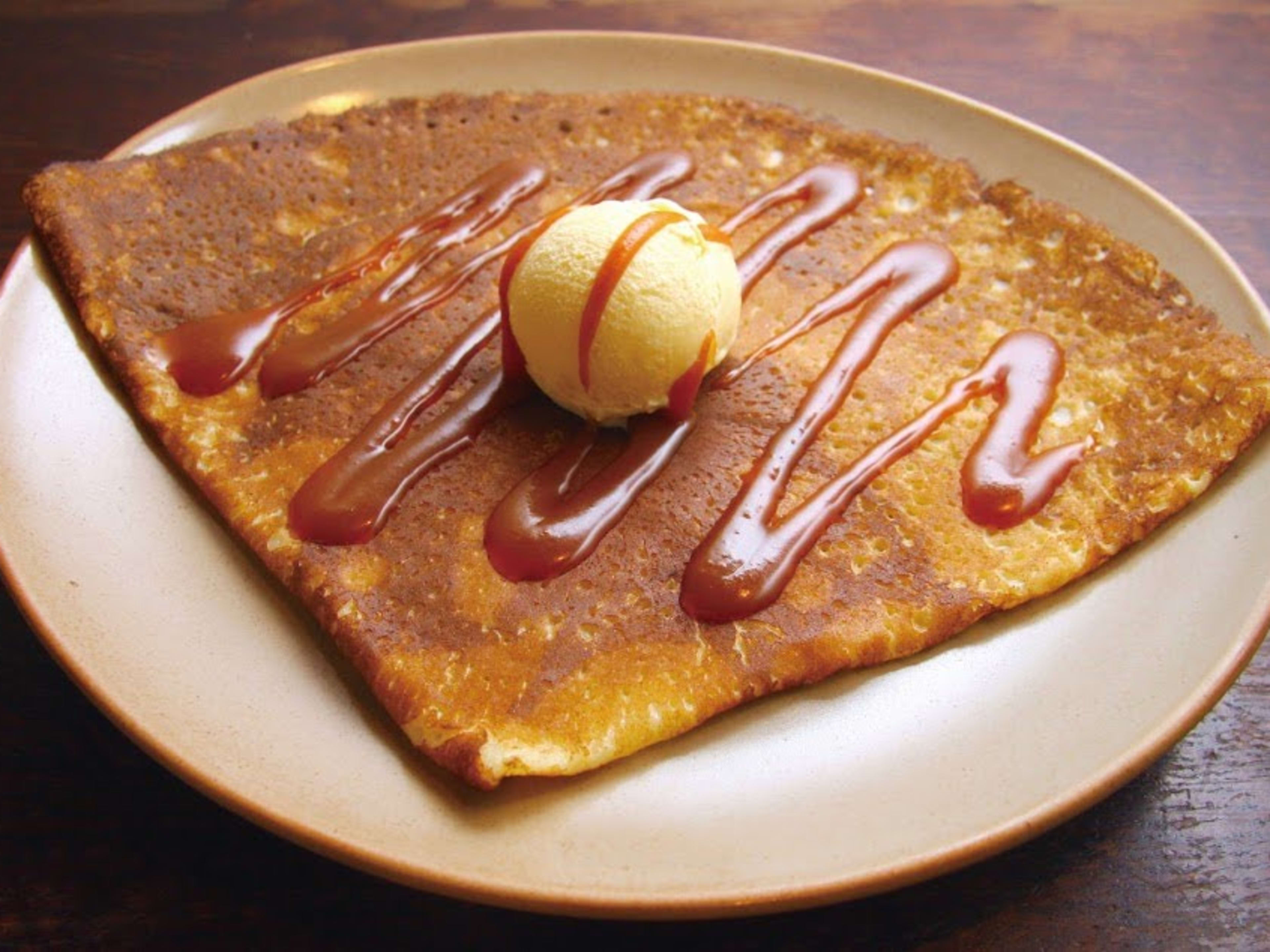 Crepe vanille caramel with scoop of ice cream on top at Cafe Breizh