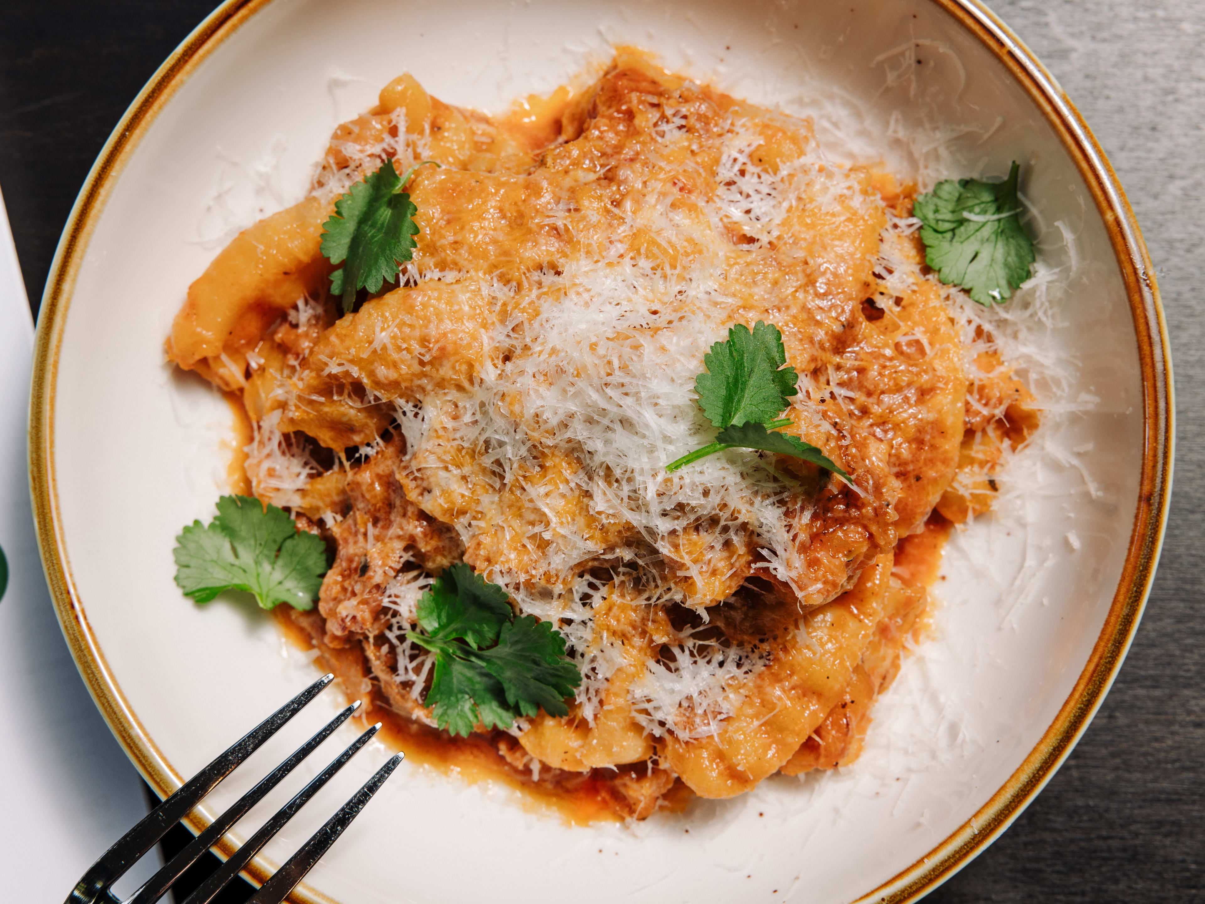 Pasta all’Amatriciana topped with Italian parsley