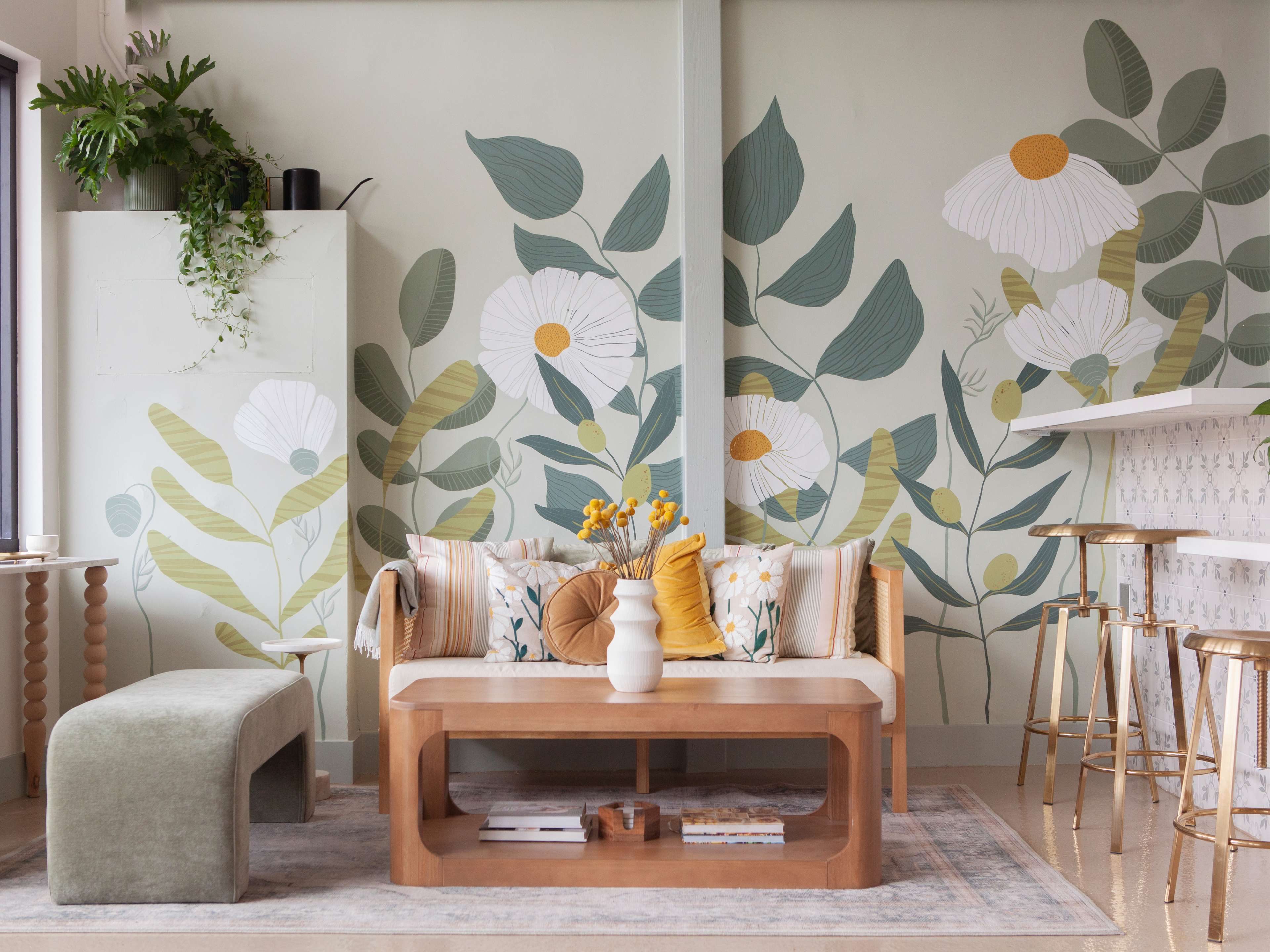 whimsical restaurant interior with floral mural and soft pastel furniture