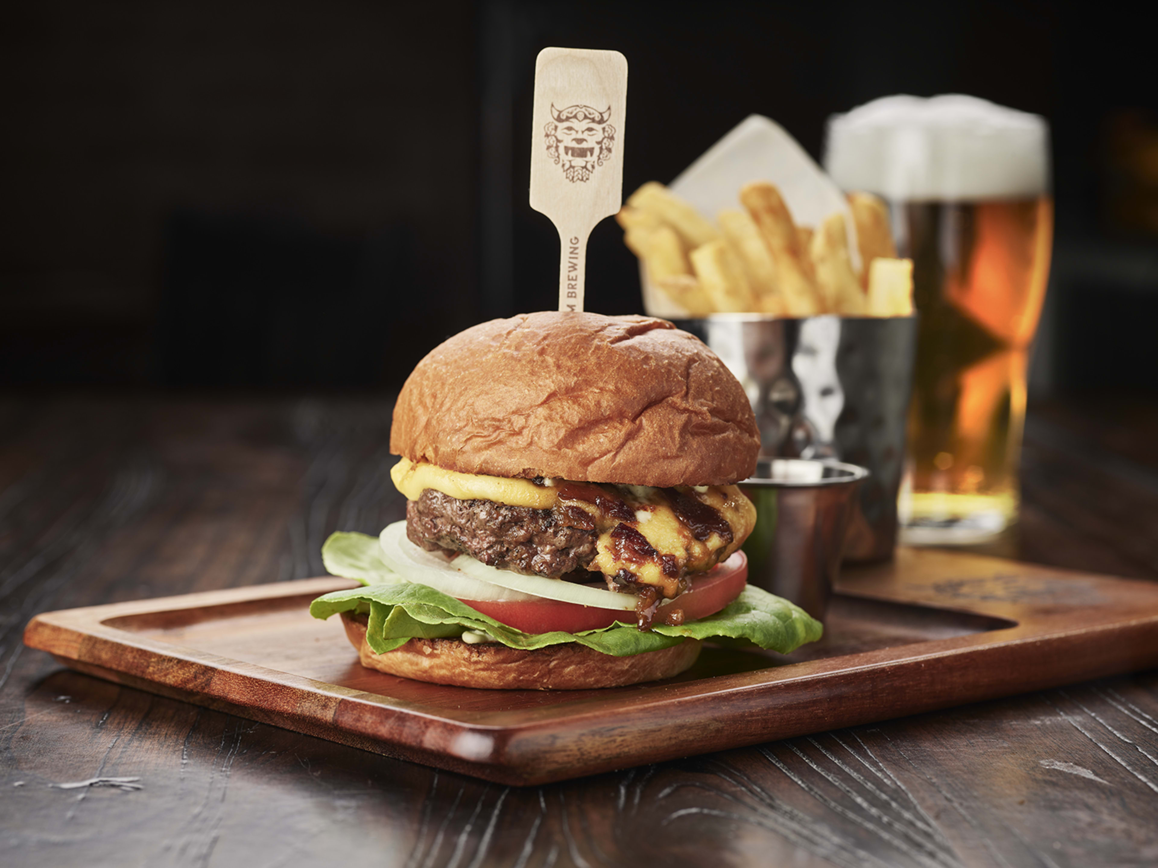 A giant burger and fries.