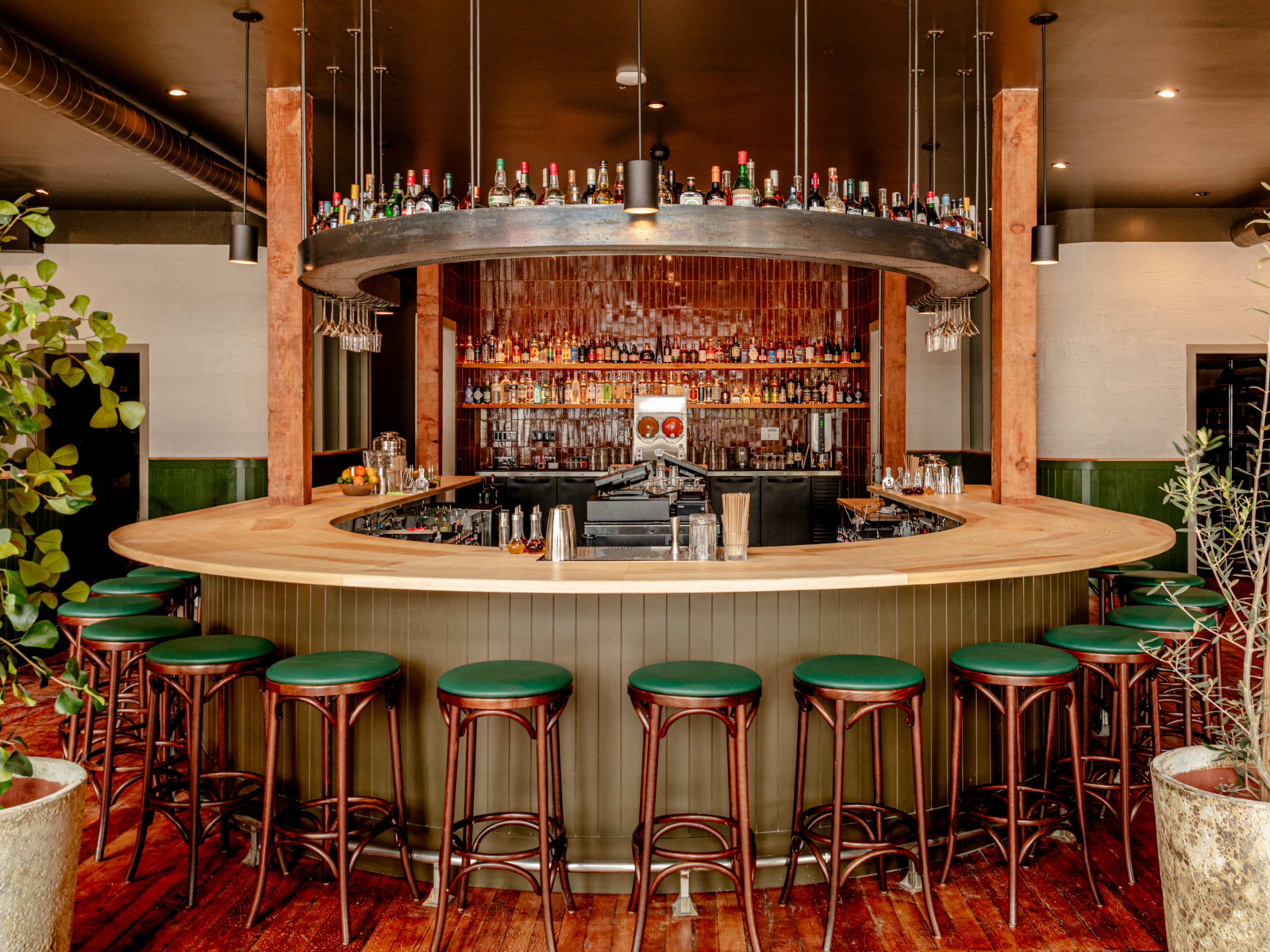 interior of bar with horseshoe shaped bar and bar stools