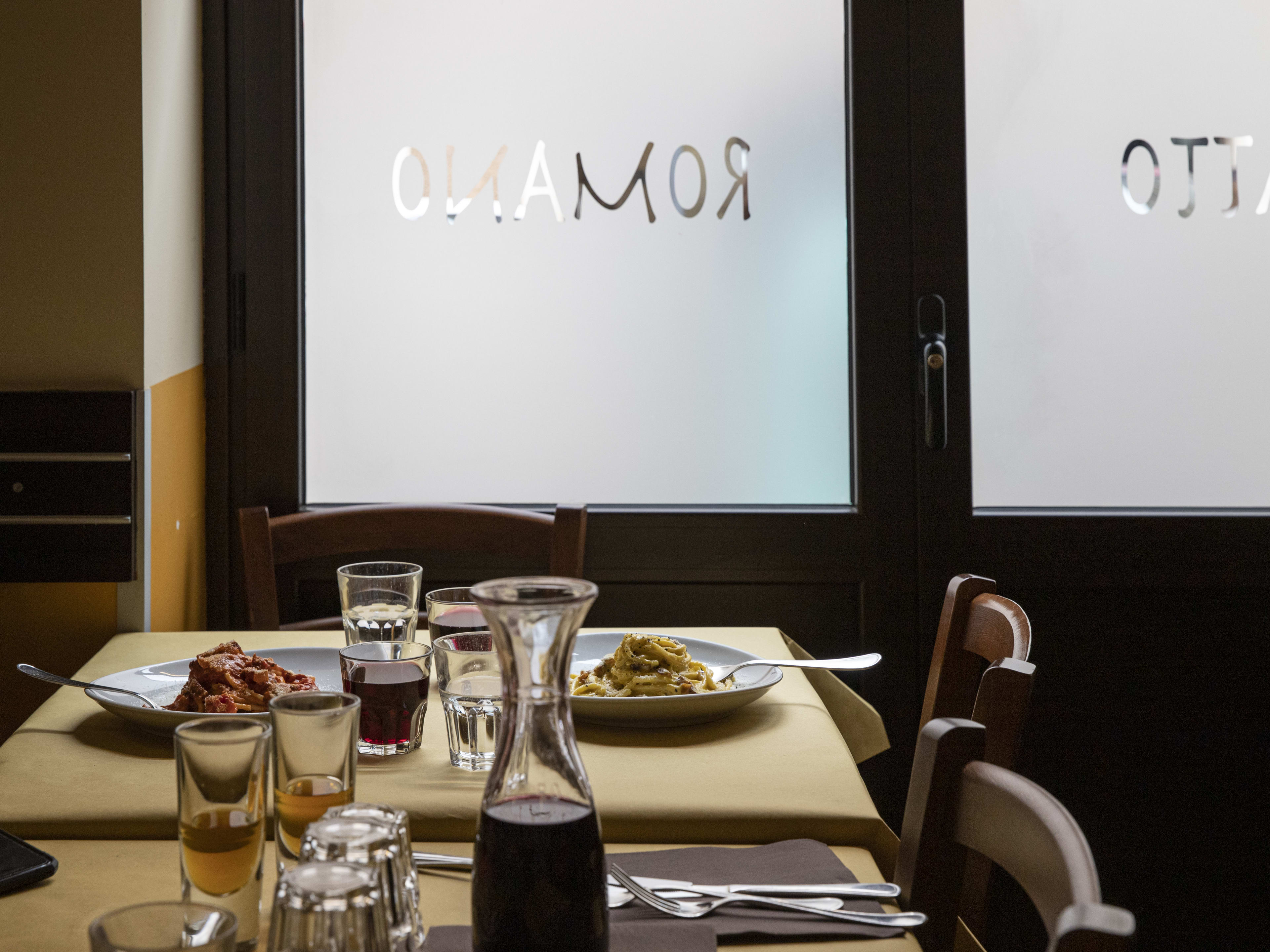 Spread of pasta dishes on table at Piatto Romano