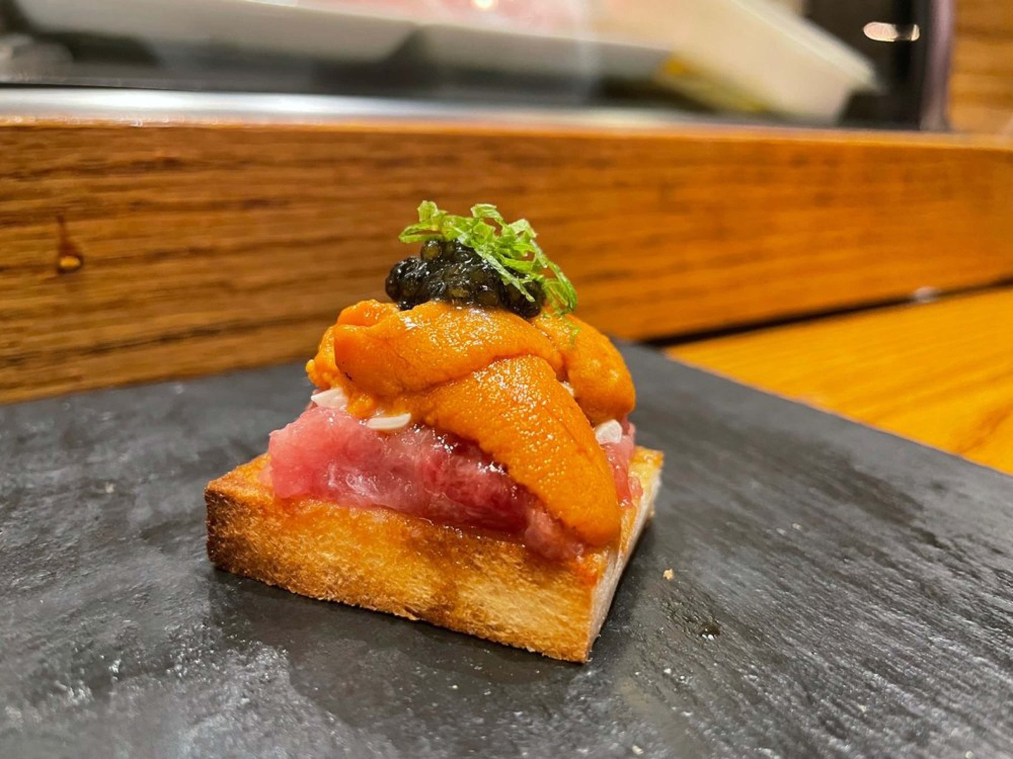 a tuna toast with uni and caviar