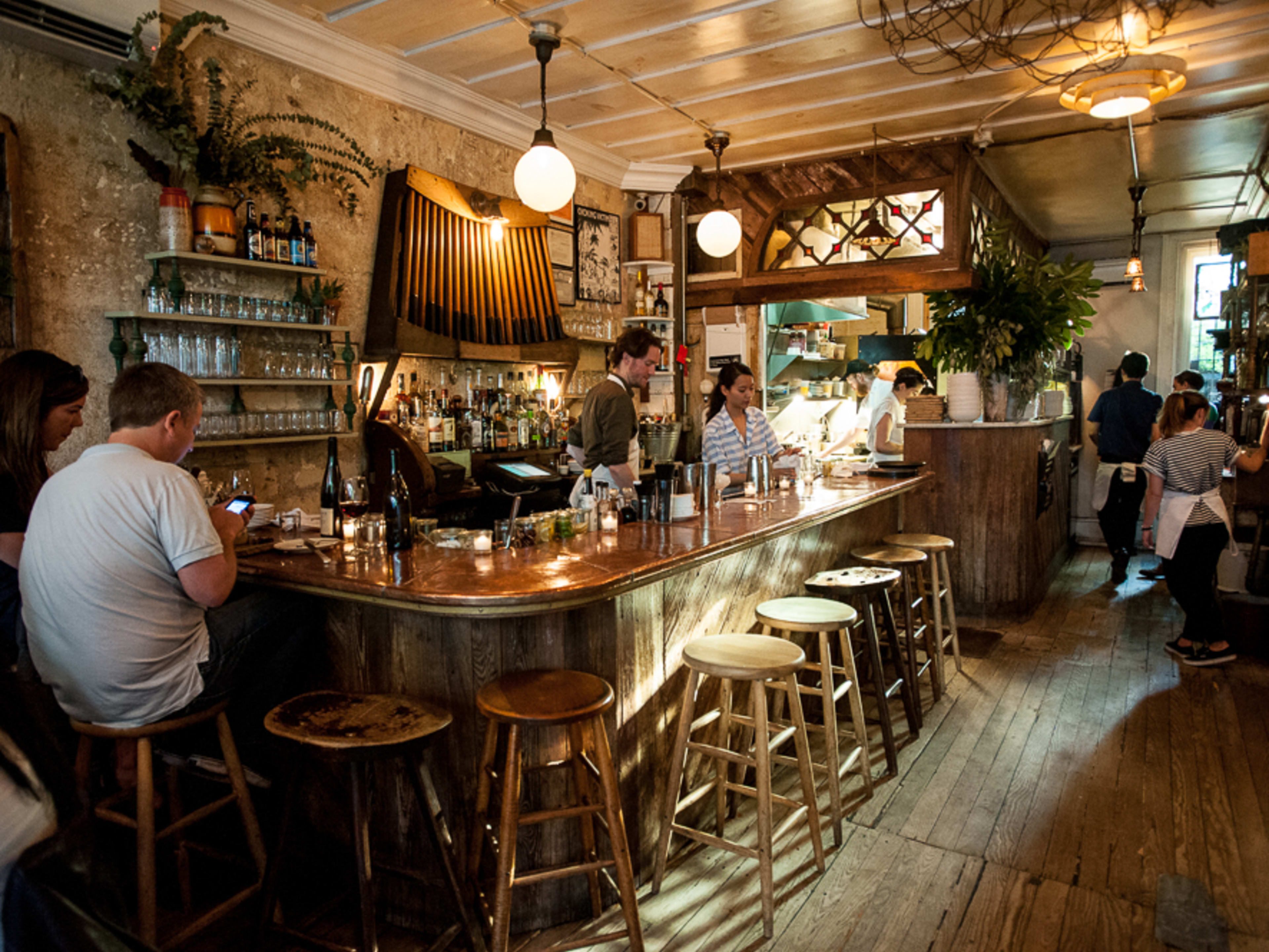 People sit at the bar at Vinegar Hill House.