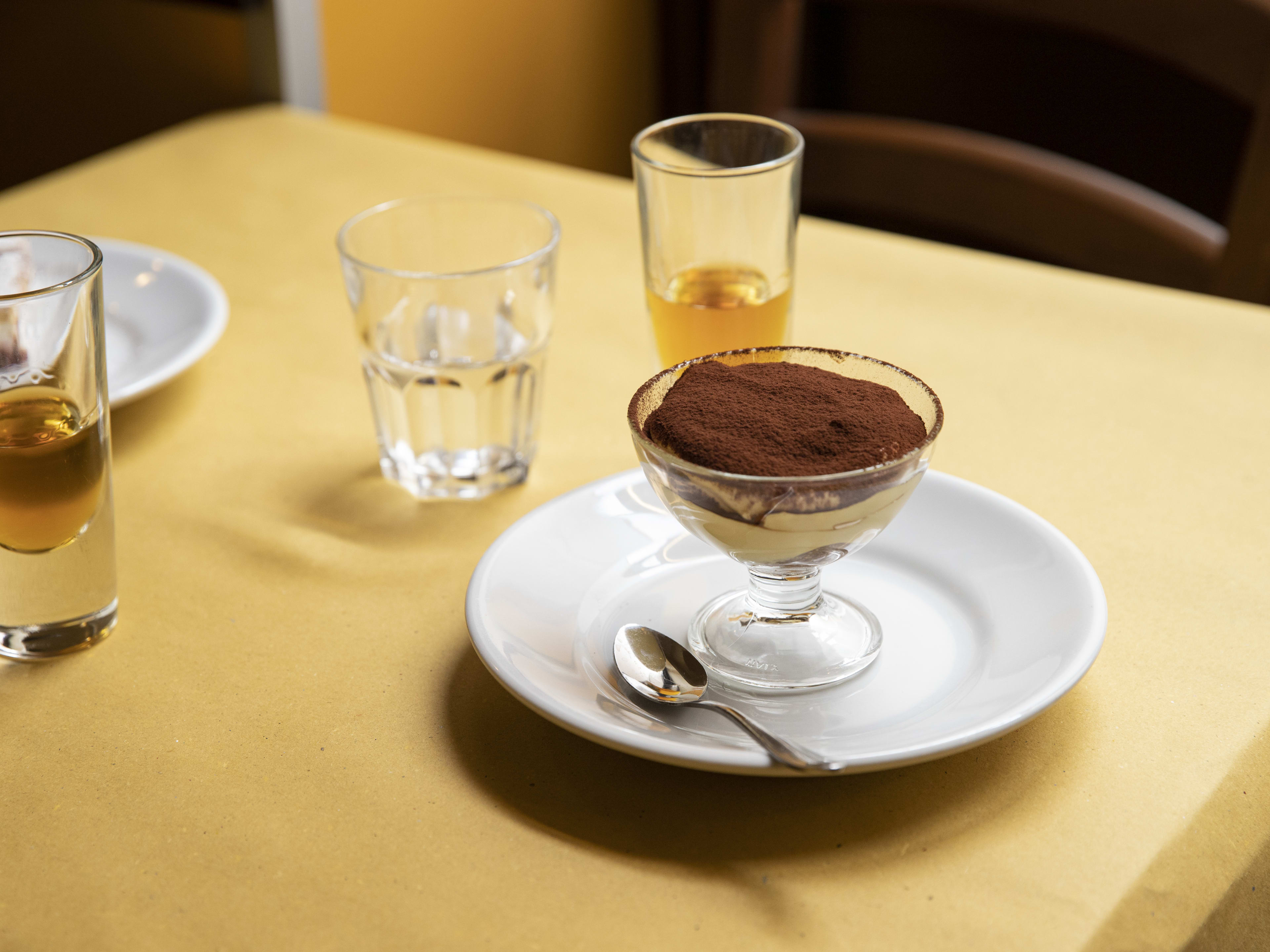 Tiramisu and digestifs on table at Piatto Romano