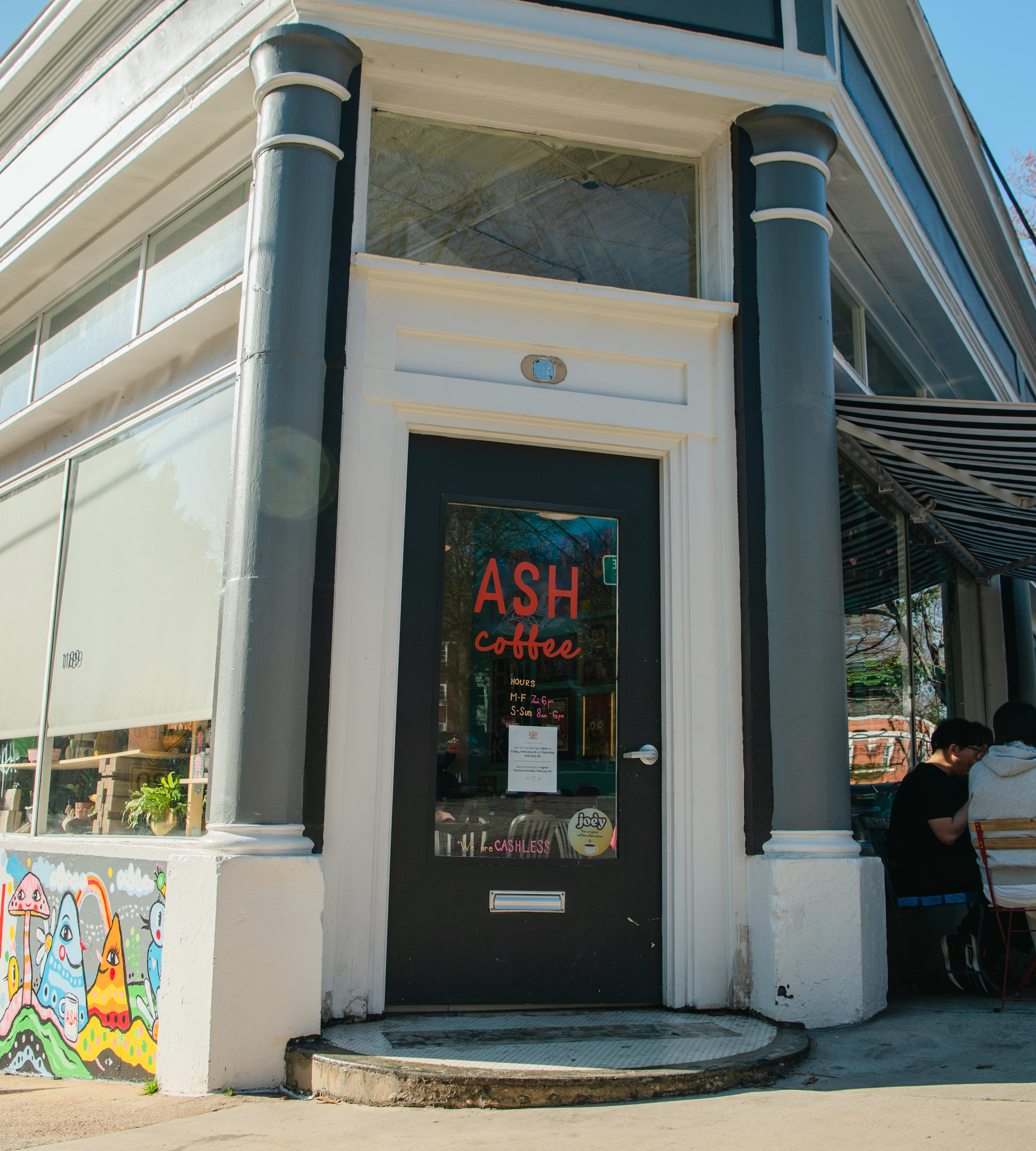 The exterior door and patio of Ash Coffee.