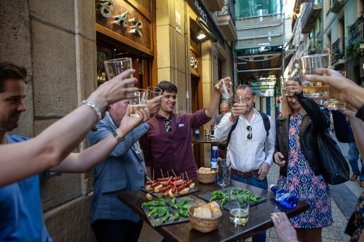 People enjoying pintxos at a local bar in San Sebastián