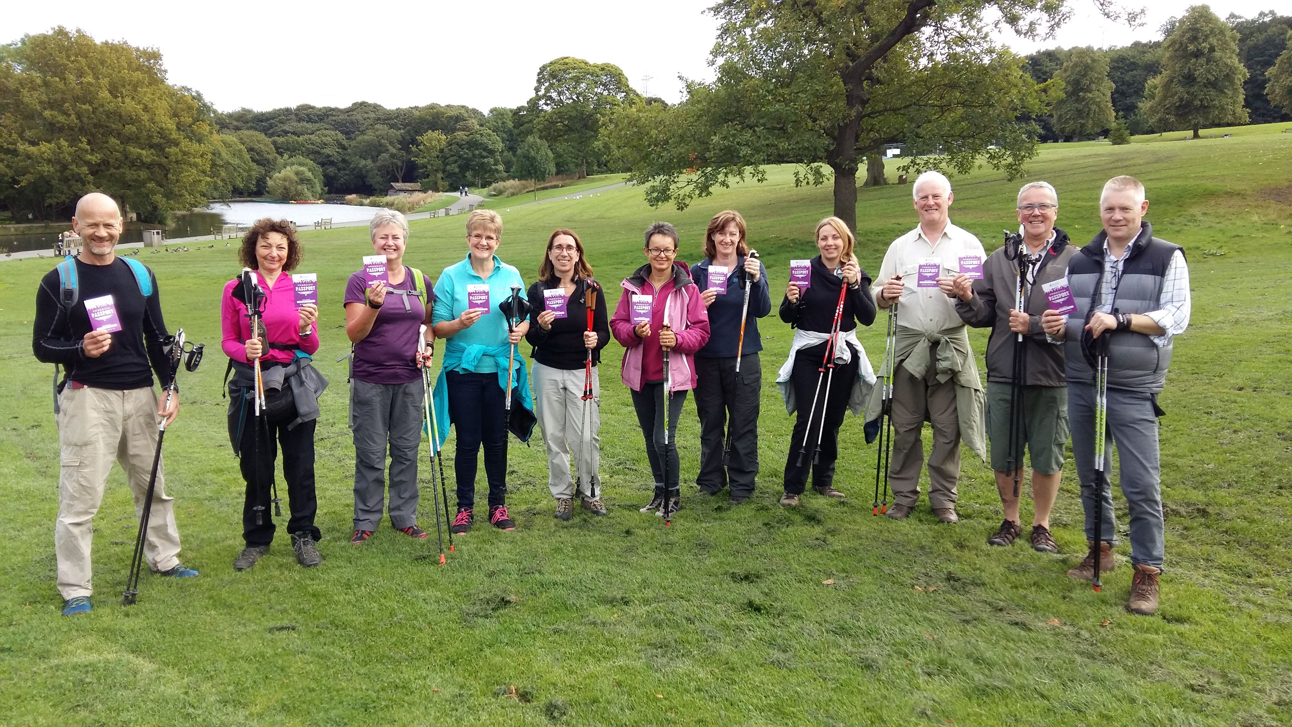 The image shows a group of Nordic Walkers in the grounds of Shibden Hall