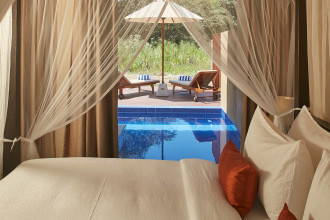 Indulge in a romantic escape in a Premium Deluxe room featuring a private plunge pool.
