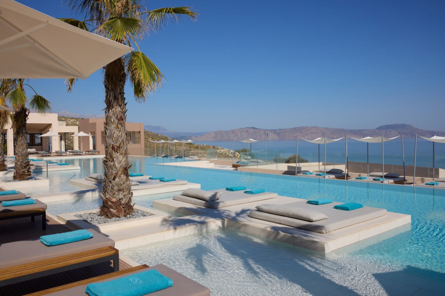 Pool terrace and sea view at ÓROS Luxury Beach Resort in Crete