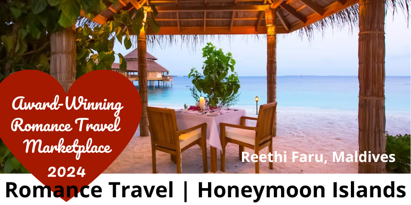 Romantic dining set up overlooking the ocean on a sandy Maldives island.