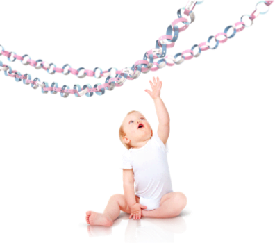 Baby reaching for birthday decorations