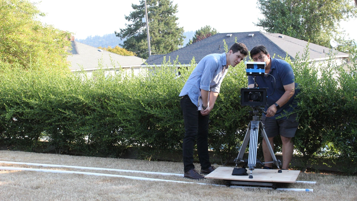 Two people setting up a shot