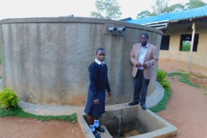The Water Project: Bumira Secondary School -  Elizabeth Koome And Principal Rocken Ilahalwa Pose At The Tank