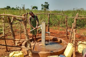 The Water Project: Katugo Community A -  Water Flowing
