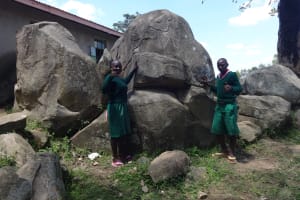 The Water Project:  Students Pose By The Rocks