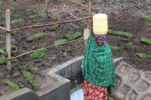 The Water Project: Emmachembe Community, Magina Spring -  Ready To Bring Clean Water Home