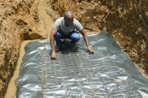 The Water Project: Bumavi Community, Joseph Njajula Spring -  Laying Foundation