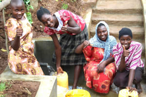 The Water Project: Namarambi Community, Iddi Spring -  Women Give Thumbs Up