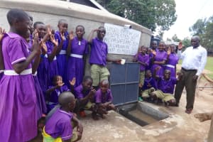 The Water Project: Chiliva Primary School -  Students And Staff Pose With Tank