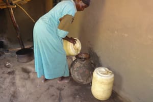The Water Project:  Pouring Water Into Storage Container