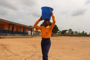 The Water Project:  Student Carrying Water