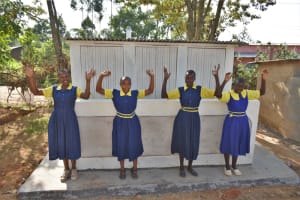 The Water Project: Jimarani Primary School -  Girls Posing At Their New Latrines