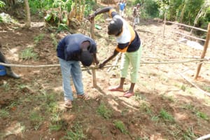 The Water Project: Eshimuli Community, Mbayi Spring -  Setting Up Of Protective Fence