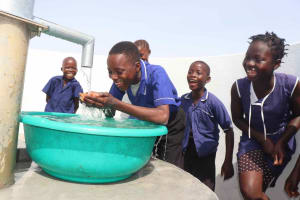 The Water Project: Movement of Faith Islamic Primary School -  Joyfully Drinking Clean Water