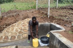 The Water Project: Shianda Community, Aburil Spring -  Collecting Water