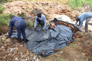 The Water Project: Mushikulu A Community, Wesonga Spring -  Backfilling Tarp