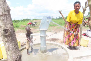 The Water Project: Rwensororo Community 2 -  People Drinking And Splashing