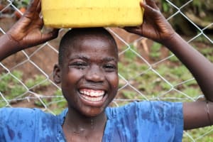 The Water Project: Shianda Community 11 -  Girl Carrying Water