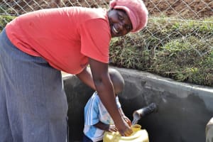 The Water Project: Lusumu Community 2 -  Fetching Water