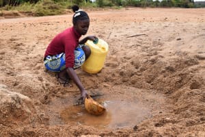 The Water Project: Kasioni Community 4B -  Kaluki Fetching Water