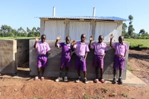 The Water Project: Mukhungula Primary School -  Boys Pose By Their Latrines
