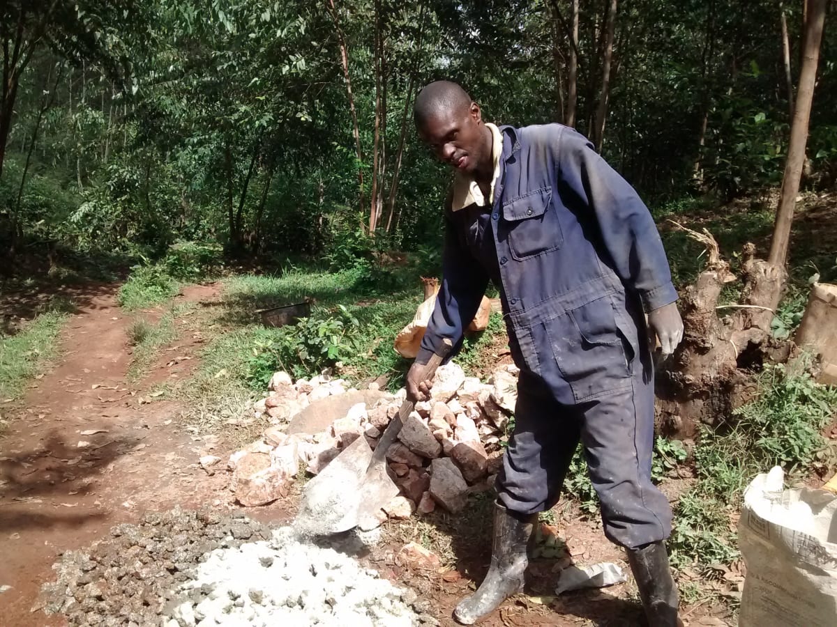 11 kenya4716 Mr. Anziva helping the artisan