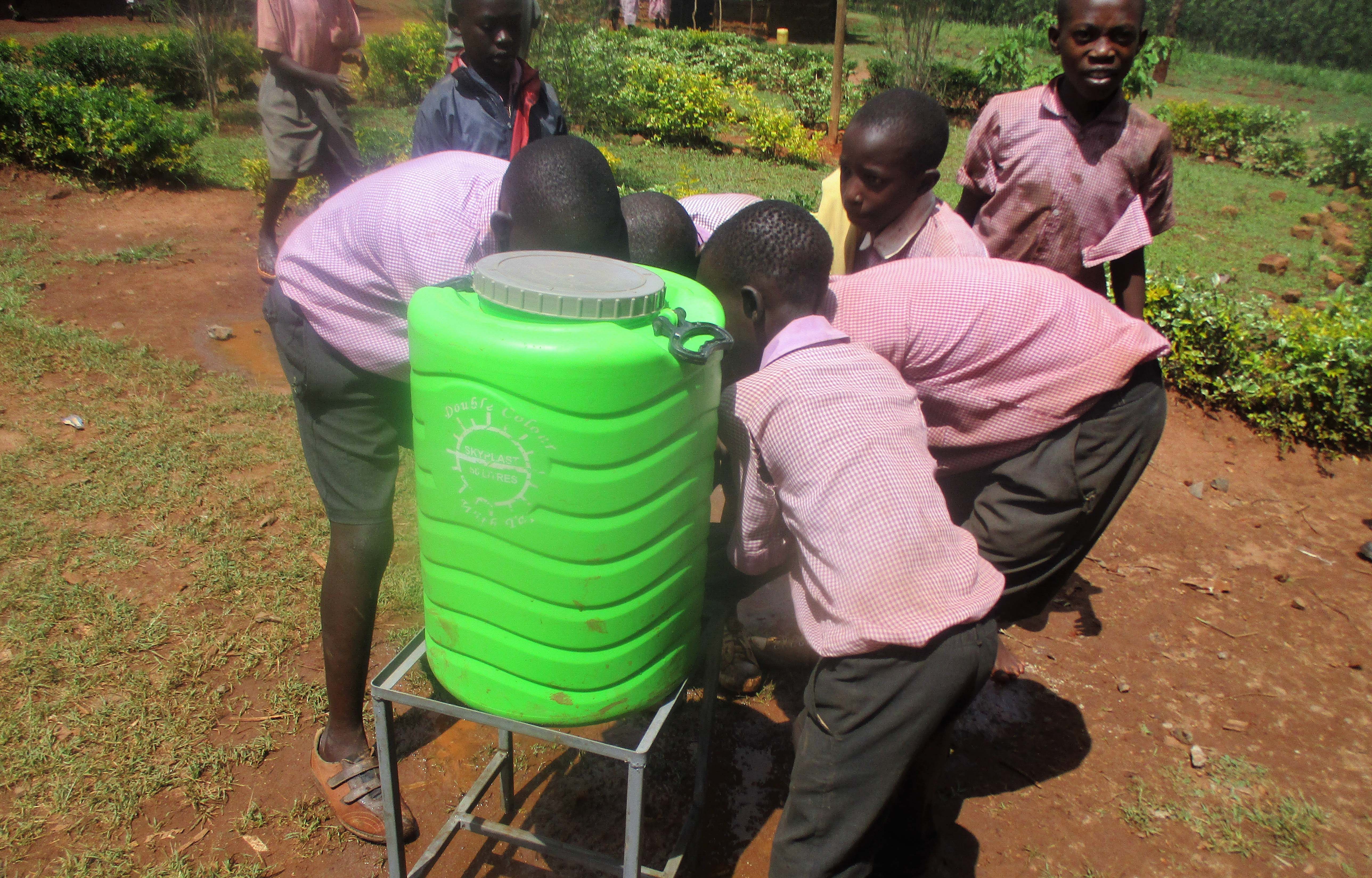 4 kenya4662 students trying the hand-washing station during training