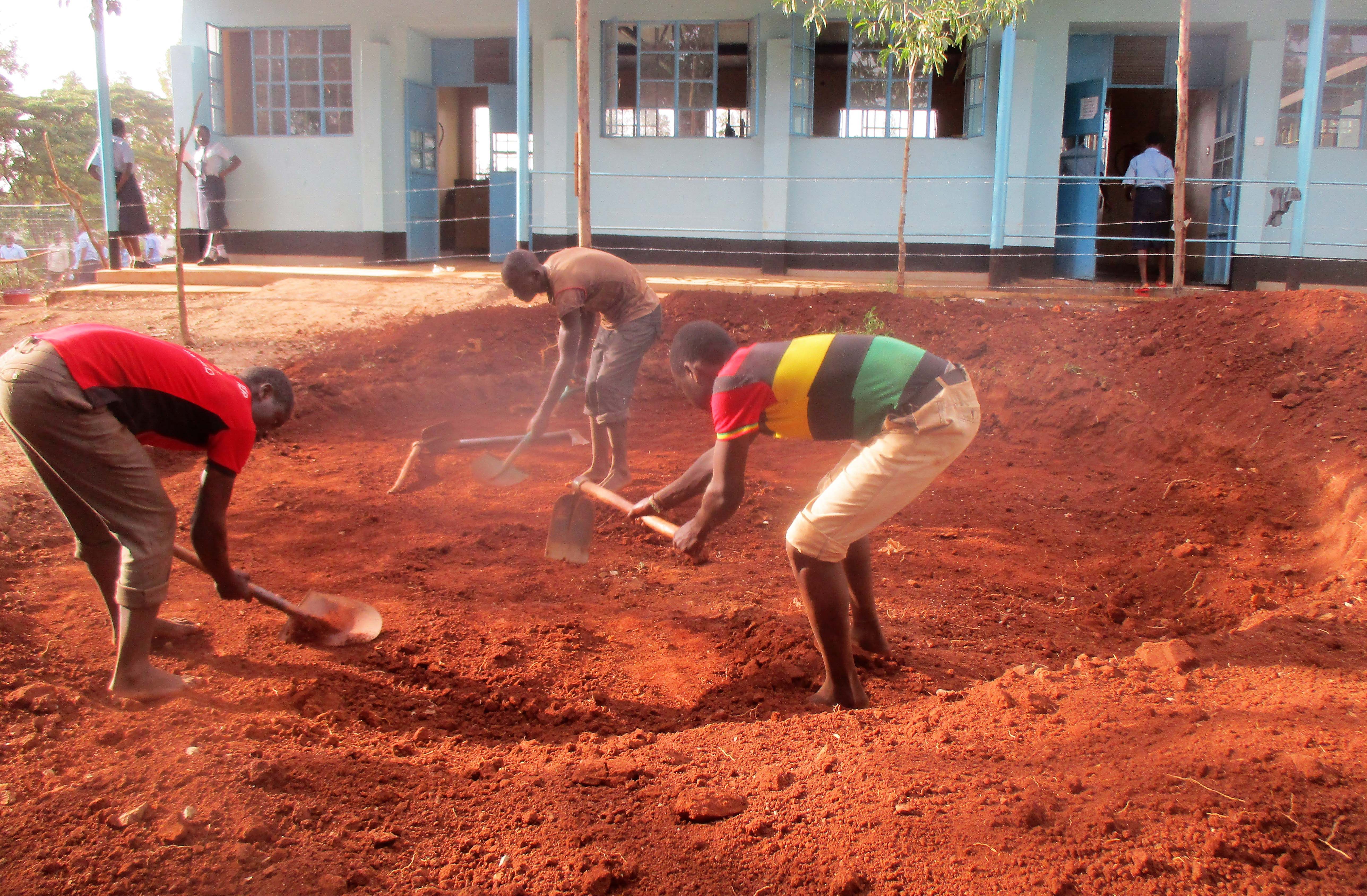 5 kenya4651 community members helping level the ground for the tank