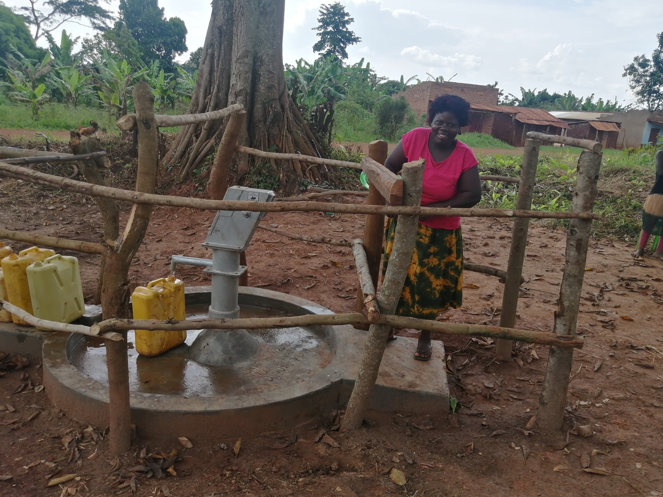 Caroline pumping water.