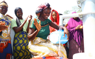 Community celebration after well completion in Sierra Leone