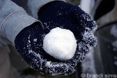 A snowball in someone's hands