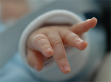 Child's hand, but no support from wealthy family