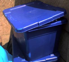 A blue household waste recycling bin.